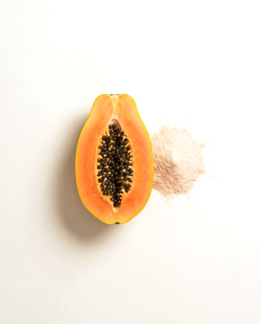 Half a papaya with pale powder
